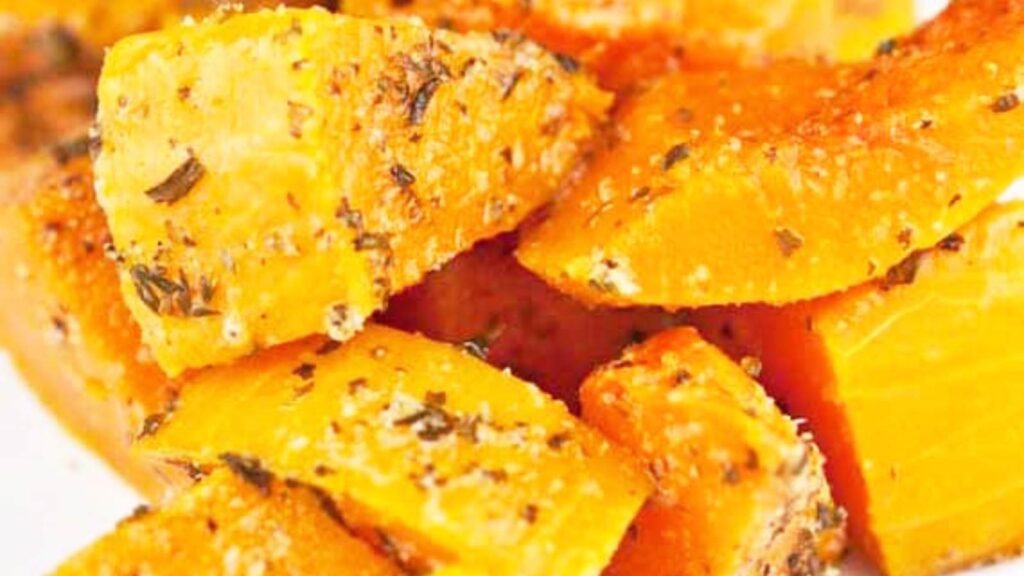A closeup of Herb Butternut Squash on a white plate.