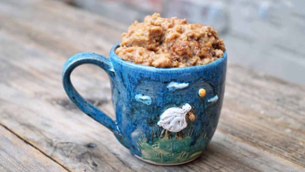 A decorative mug filled with Irish Goody.