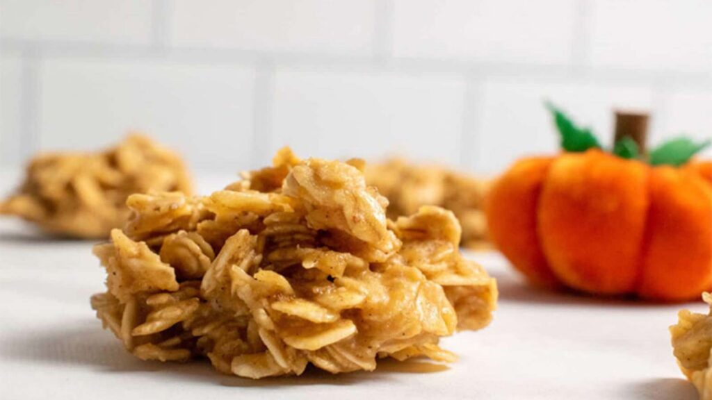 A closeup of a No Bake Pumpkin Cookie on a white surface.