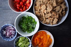 All the ingredients in individual bowls for this Panzanella Recipe.