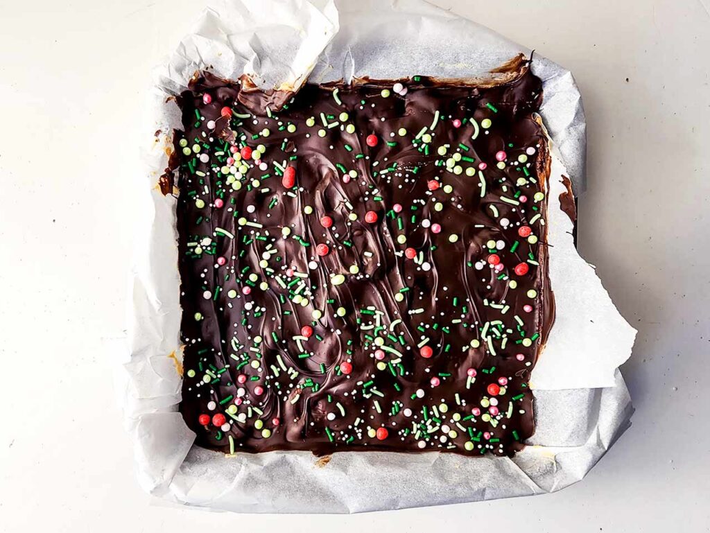 The chilled Peanut Butter Chocolate Bars in a baking pan after chilling.