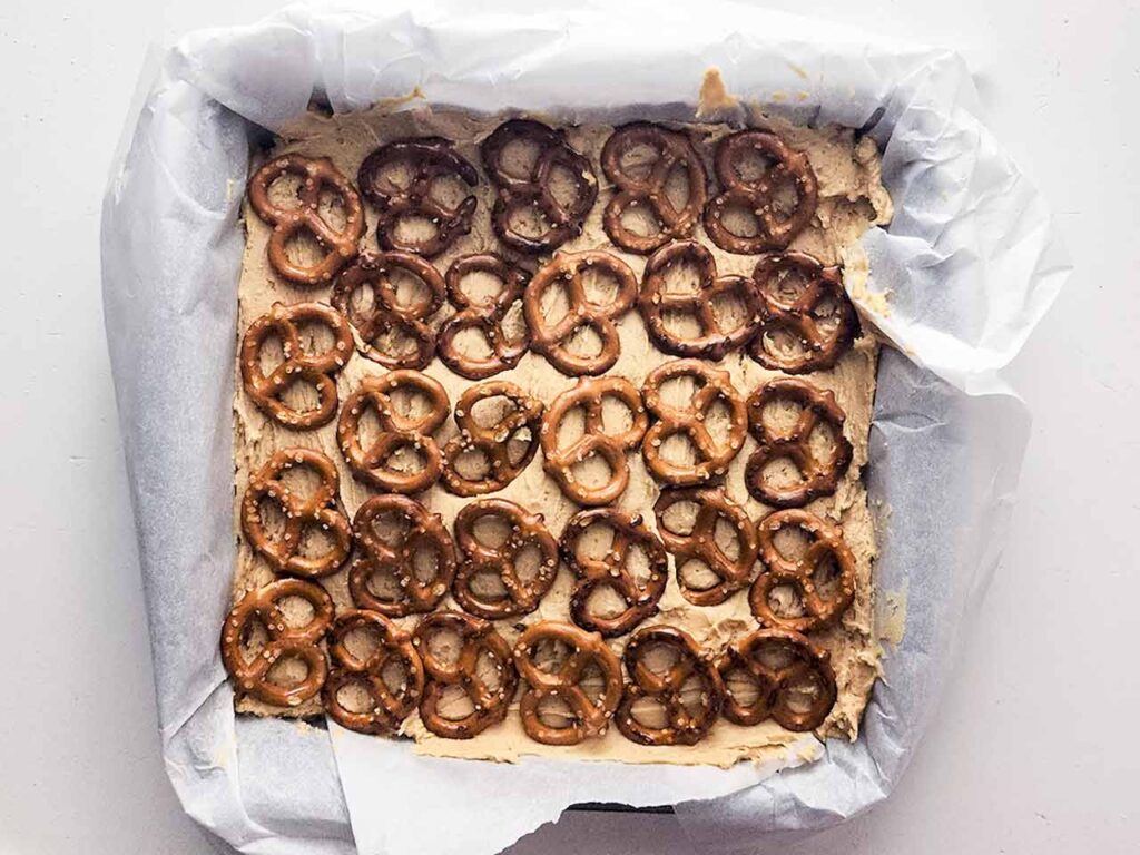 Pretzels pressed into the peanut butter batter.