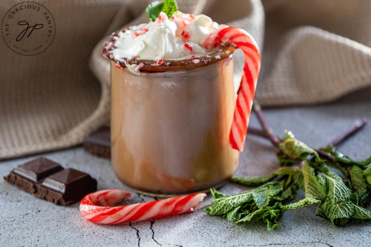 A finished cup of Peppermint Hot Chocolate in a glass mug.