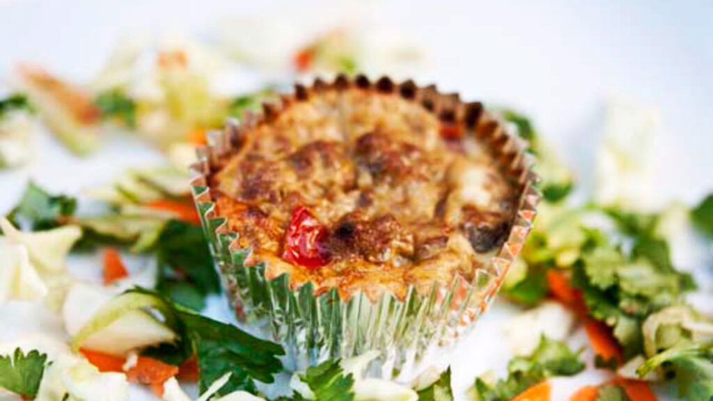 A single Southwestern Breakfast Muffin on a white surface.