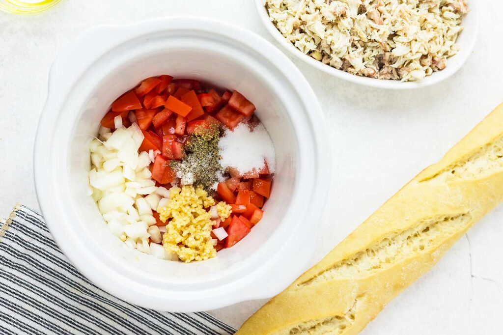 Crab mix ingredients in a small slow cooker.