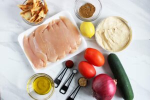 Mediterranean Bowl recipe ingredients gathered on a white, marble surface.
