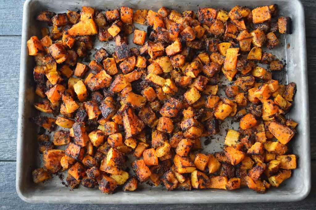 Roasted Butternut Squash roasted and cooling on a sheet pan.