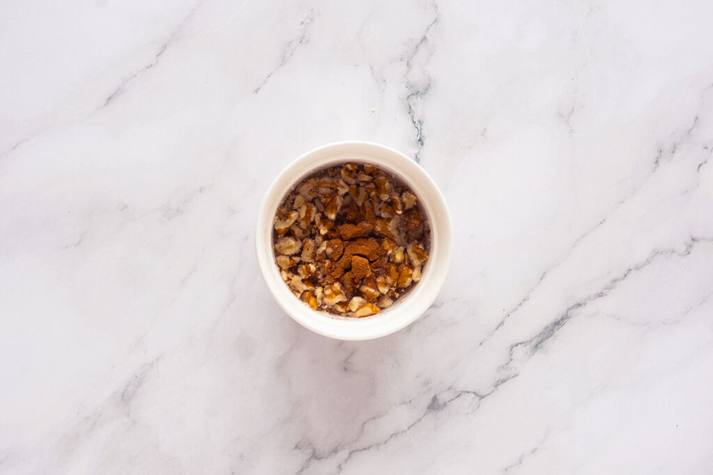 Chopped walnuts in a bowl.