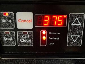 An oven temperature display panel set to 375 degrees Fahrenheit.