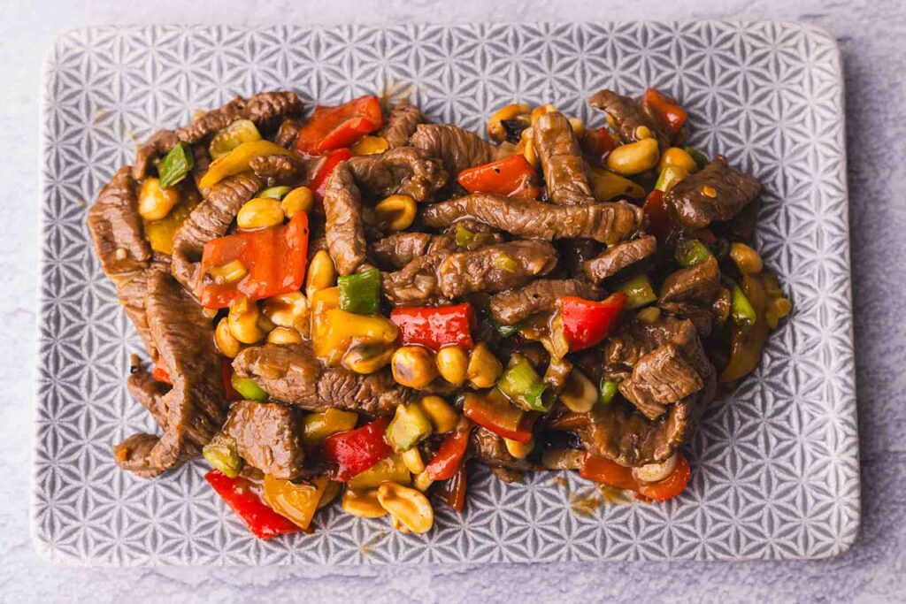 An overhead view of Kung Pao Beef on a platter.