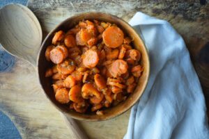 Dill carrots served in a wooden bowl.