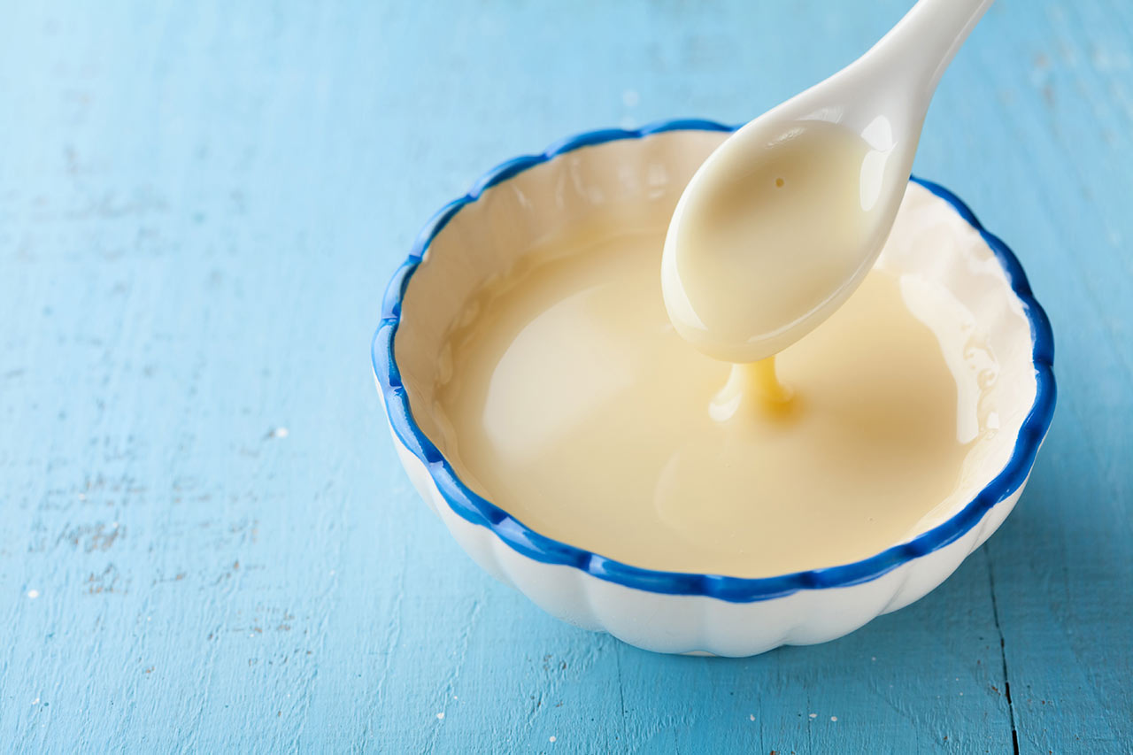 A small bowl of evaporated milk.