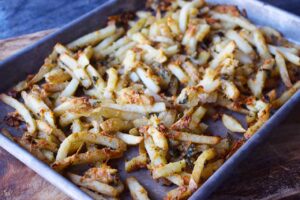 Garlic fries on a baking sheet.