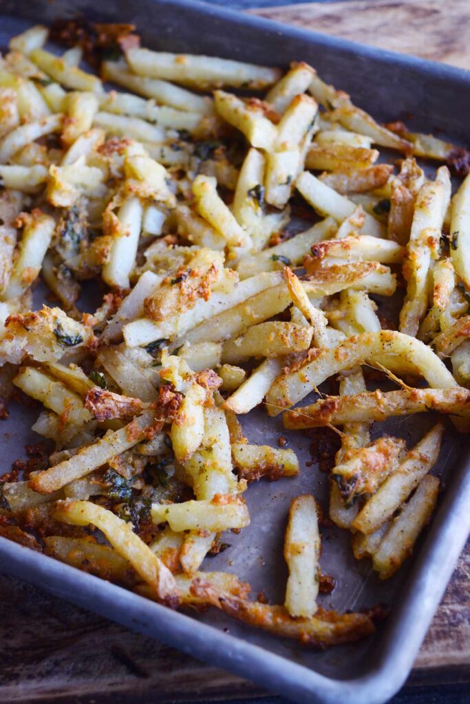 Garlic fries on a sheet pan.