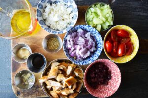 Greek Chicken Salad ingredients in individual containers.