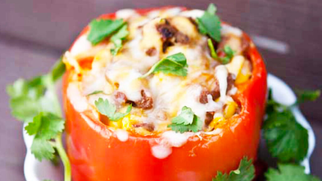A single, Mexican Stuffed Pepper in a small, white bowl.