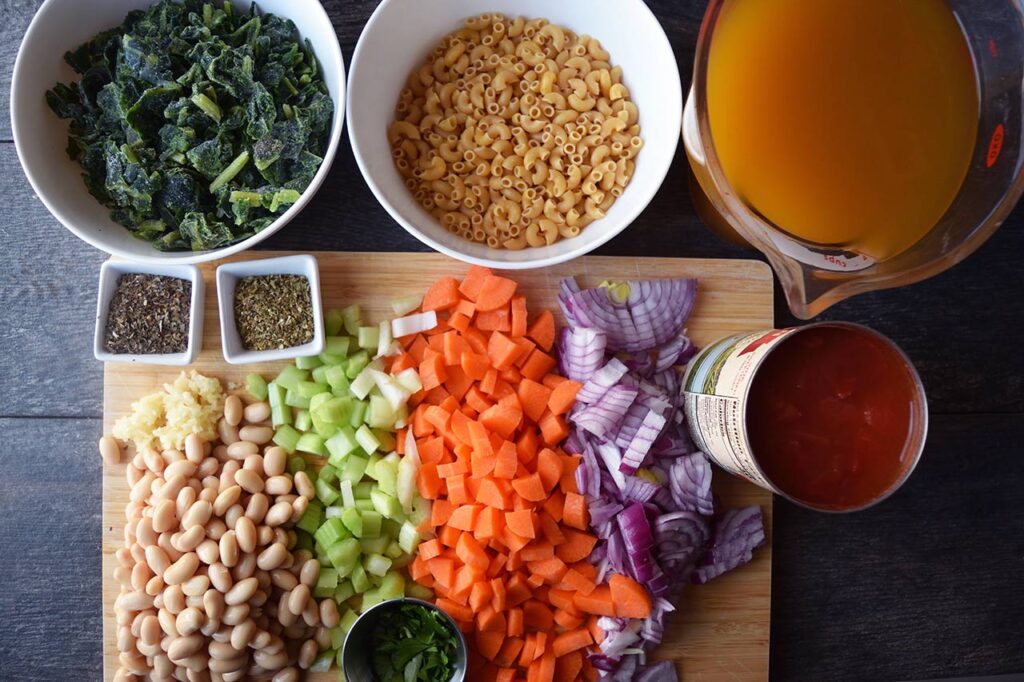 Ingredients for Pasta Fagioli gathered on a work surface.