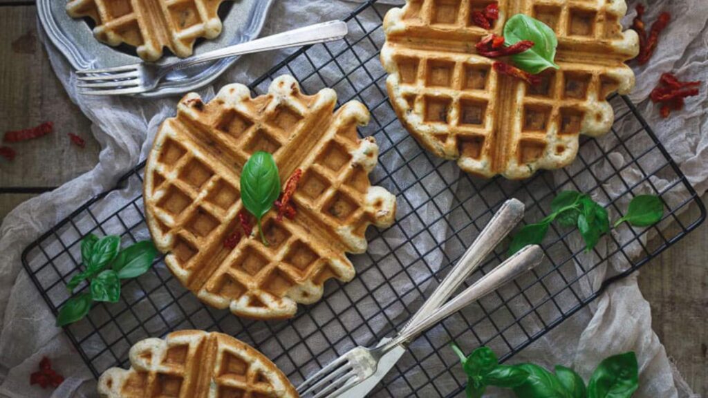 Savory hummus waffles on a cooling rack.