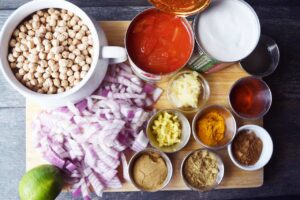 Ingredients gathered on a cutting board for this Chickpea Curry Recipe.