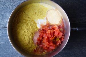 Ingredients for vegan queso in a pot.