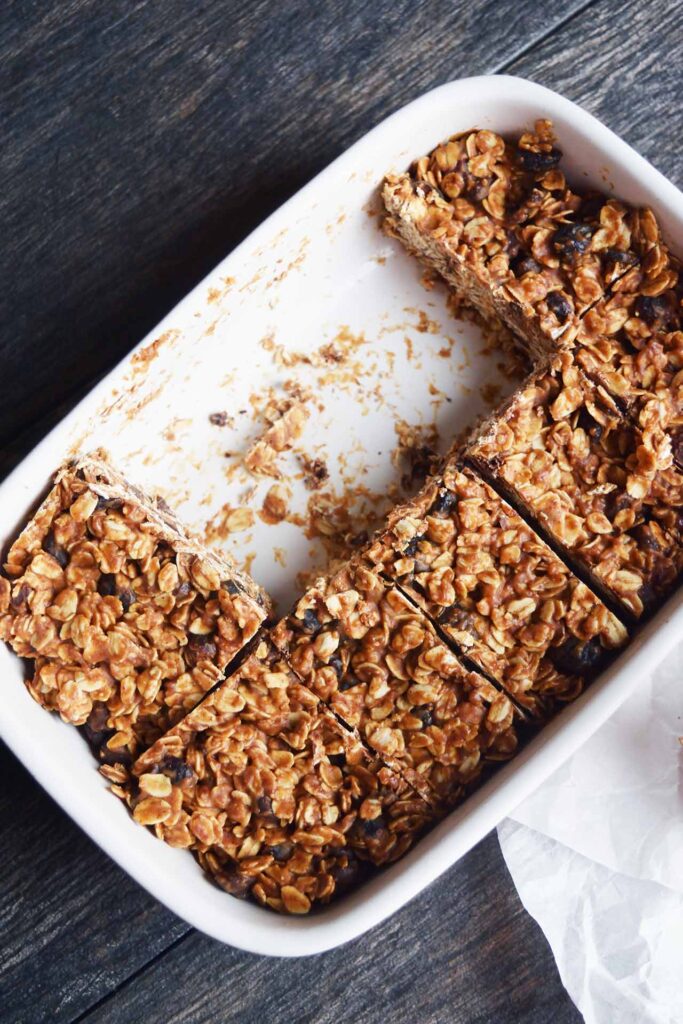 Homemade Granola Bars still in a casserole dish. Three of them have been removed.