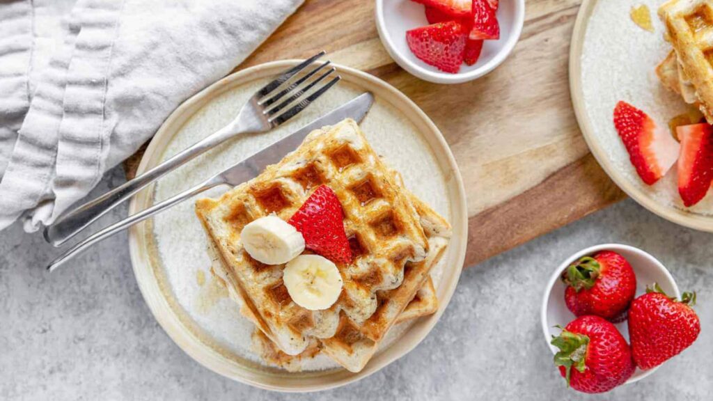 An overhead view of sourdough waffles on a plate.