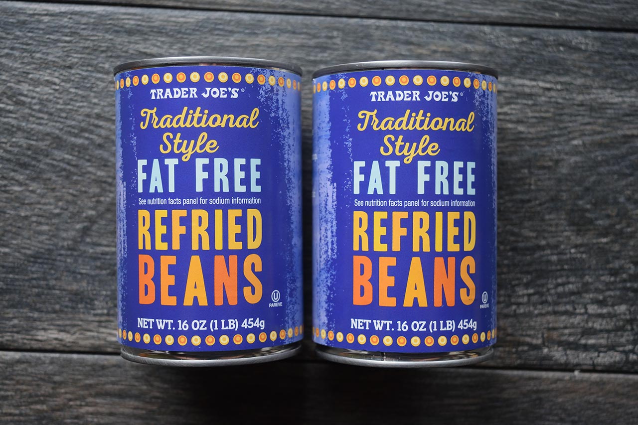Two cans of refried beans.
