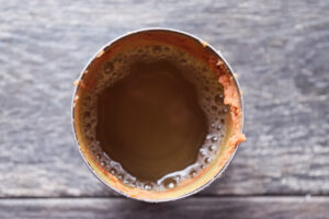 An empty refried bean can filled three quarters of the way with water.