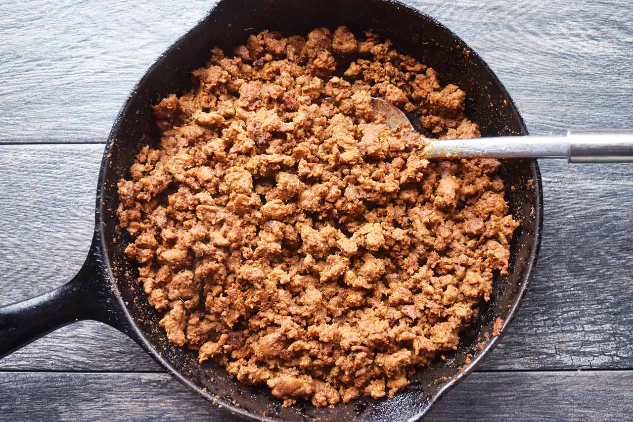 Cooked taco meat in a cast iron skillet.