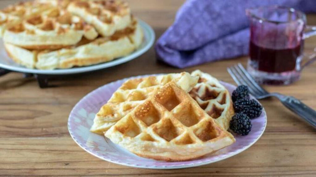 Waffle quarters on a pink plate.