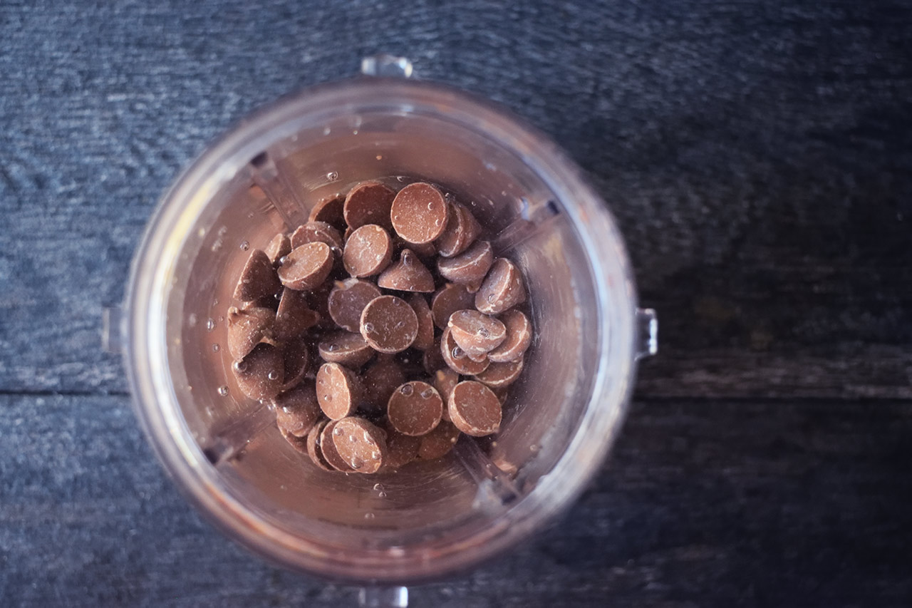 Chocolate mousse ingredients combined in a blender tumbler.