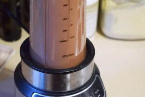 Chocolate mousse ingredients blending in a blender.