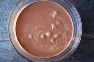 Chocolate mousse batter in a mixing bowl, ready to chill.