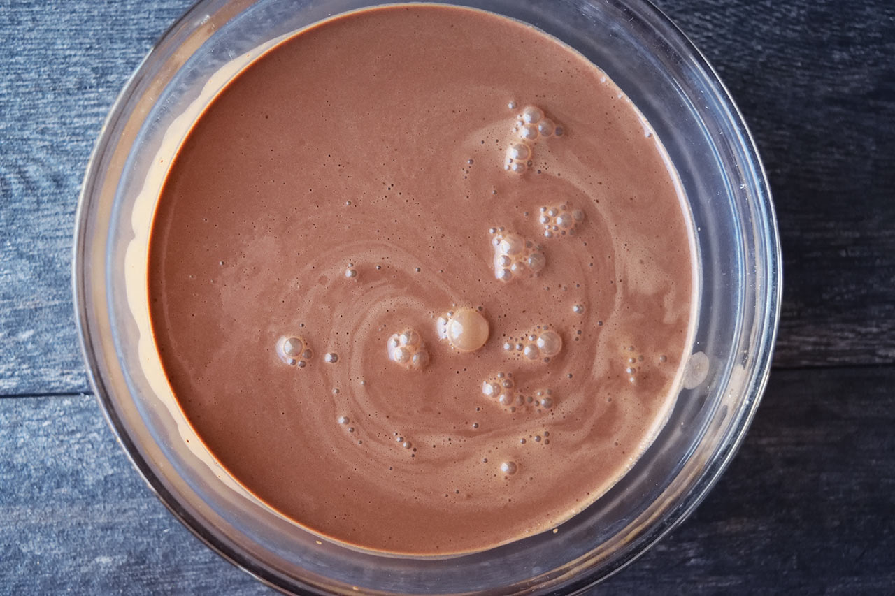 Chocolate mousse batter in a mixing bowl, ready to chill.