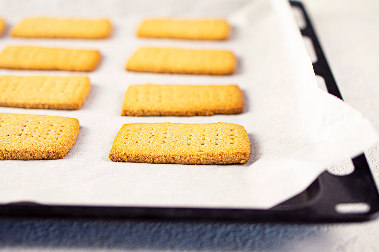 Just-baked Graham Cracker on a baking sheet, cooling.