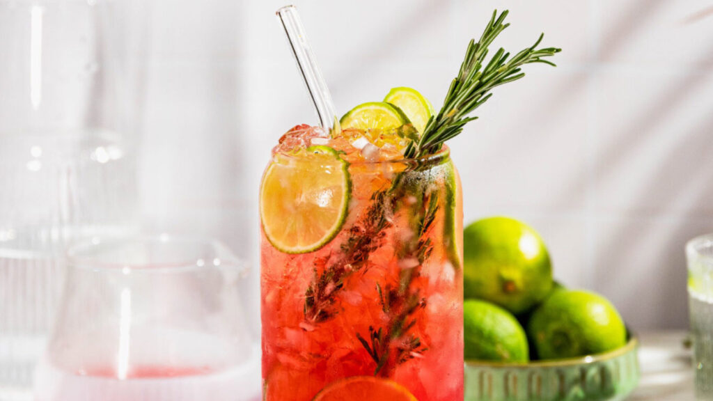 Closeup partial view of the top half of a cranberry mocktail.