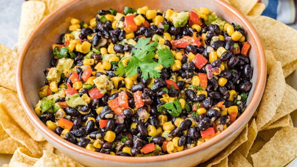 A bowl filled with Mexican black bean and corn salsa.