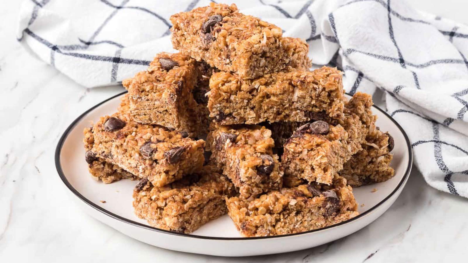 A pile of no-bake Rice Krispies granola bars on a plate.