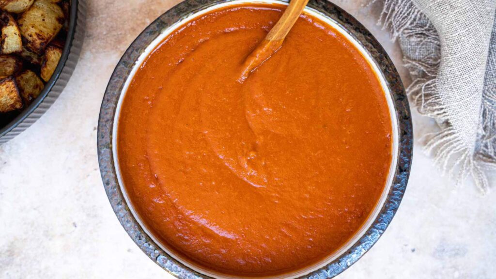 An overhead view of a bowl filled with salsa brava.