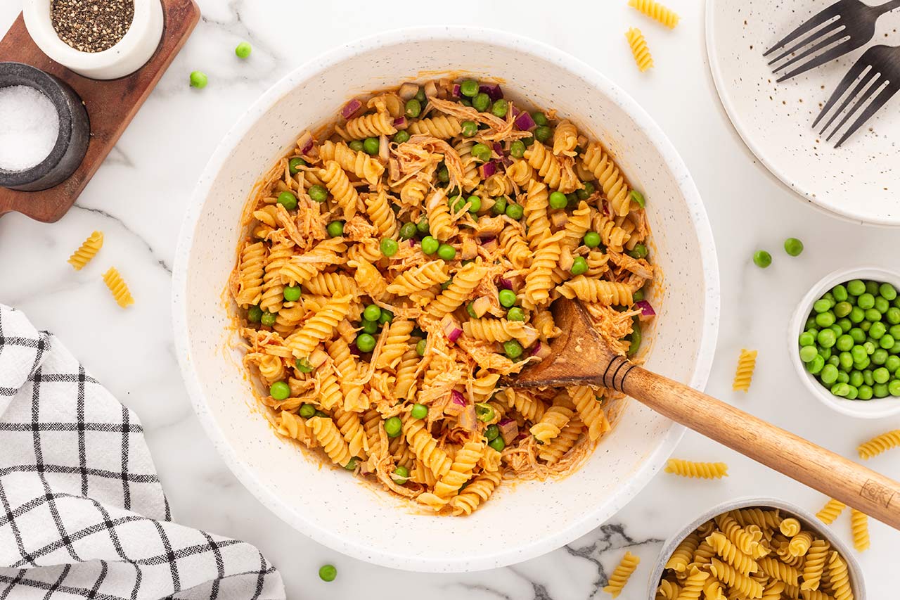 Mixed Buffalo Chicken Pasta Salad in a mixing bowl.