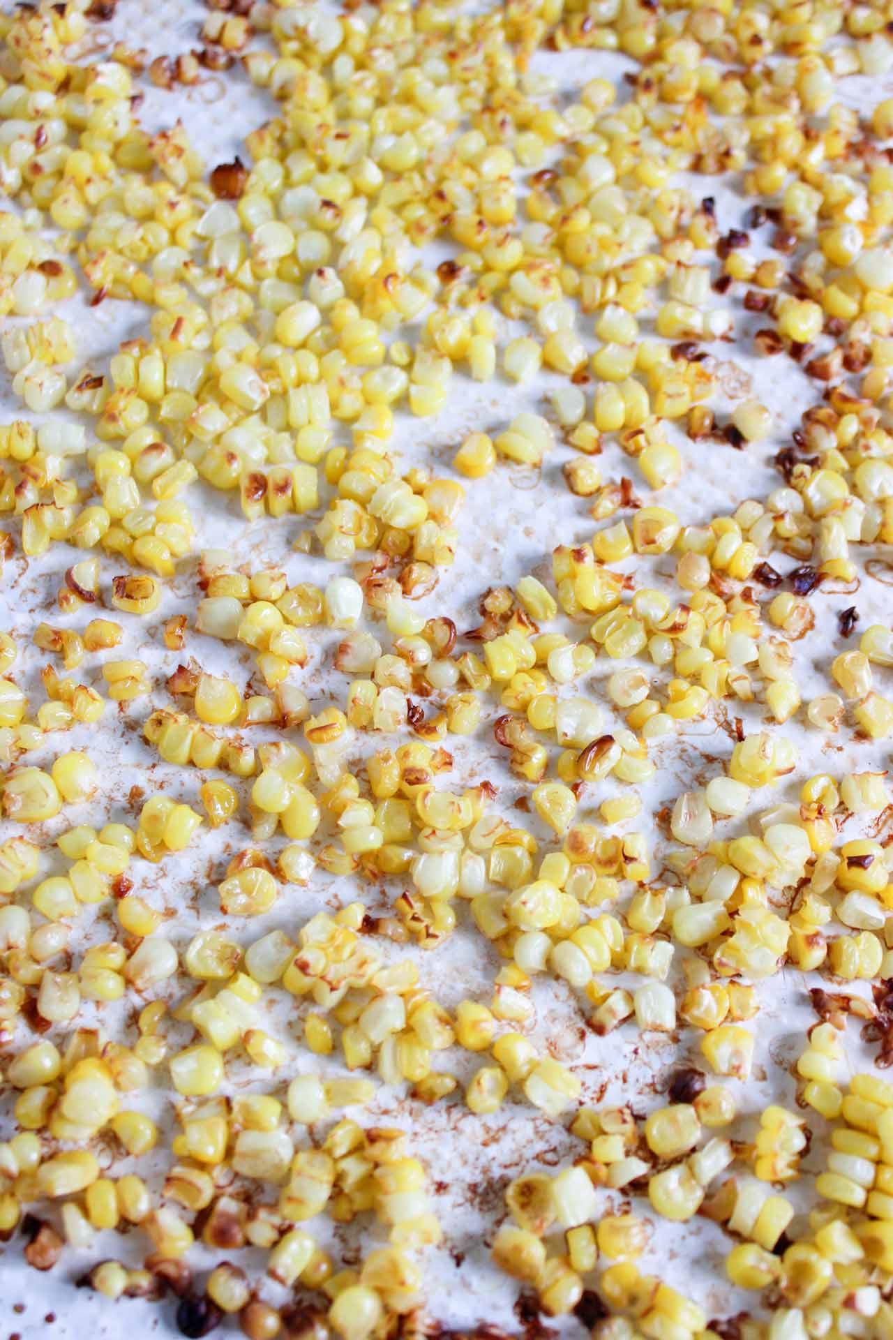 Roasted corn on a sheet pan.