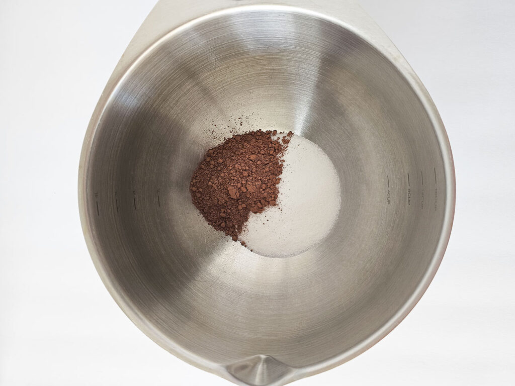 Cocoa powder and sweetener in a mixing bowl.