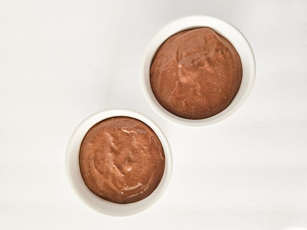 Mousse batter divided into two white bowls.