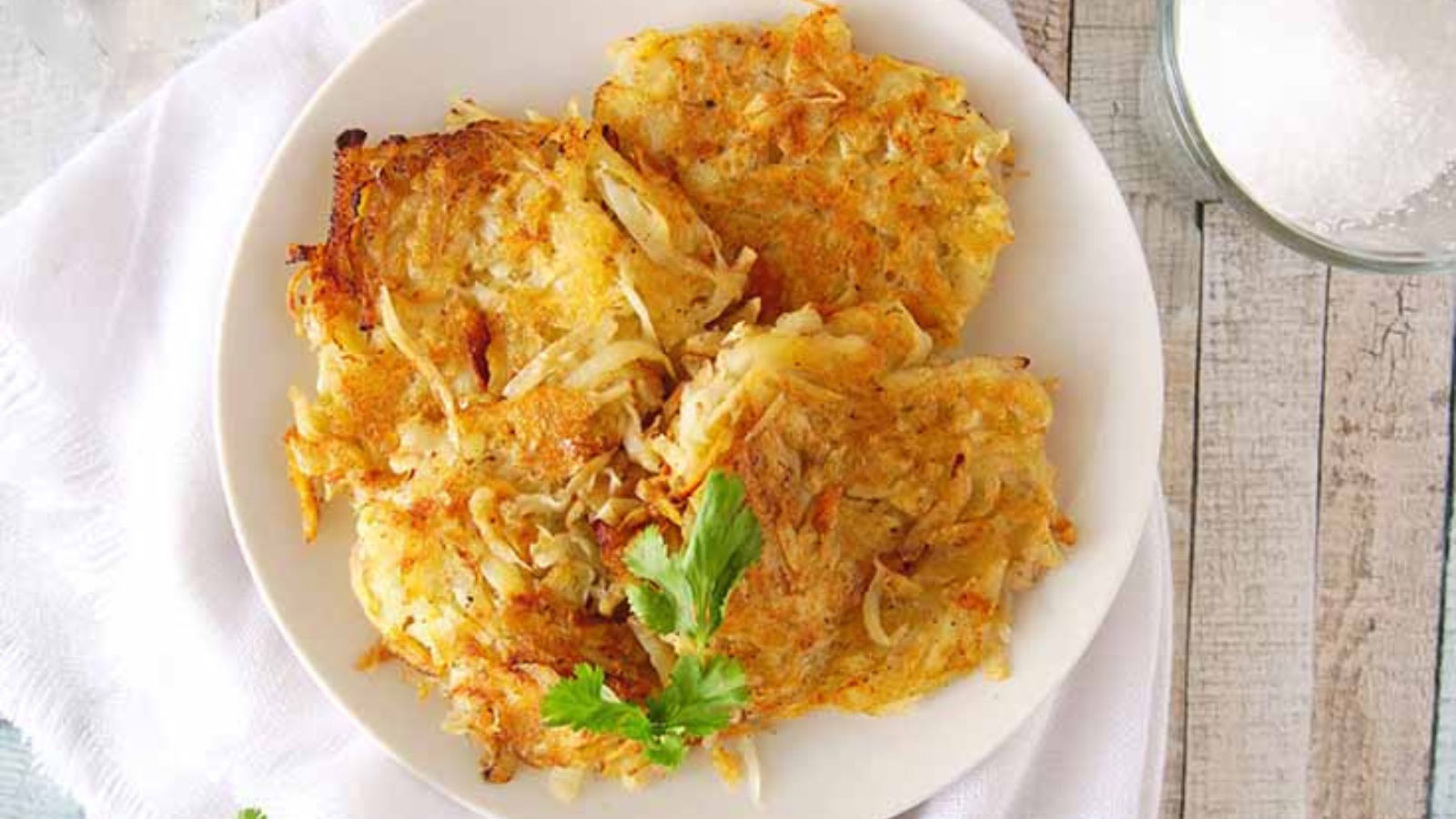 Served homemade hash browns recipe on a white plate.
