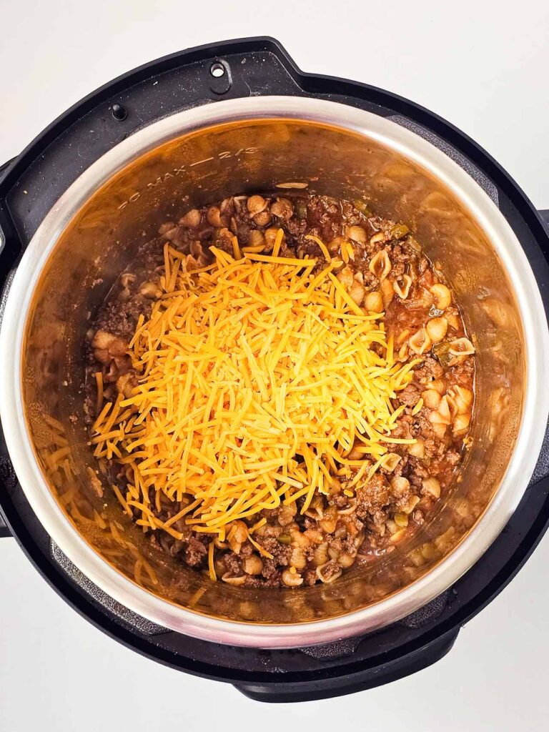 Cheddar cheese added to the taco casserole in an Instant Pot.