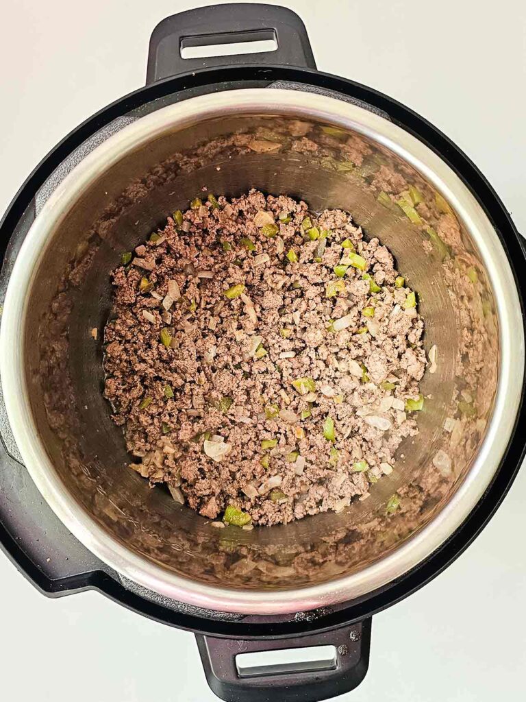 Browned meat and veggies in an Instant Pot.