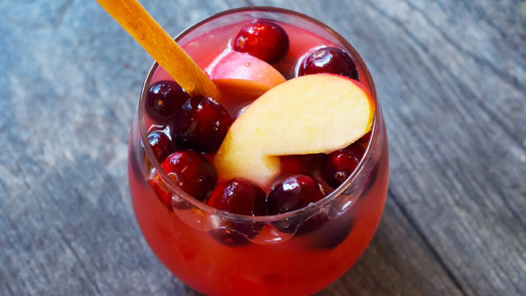 The finished Non Alcoholic Sangria Recipe, served in a stemless wine glass.