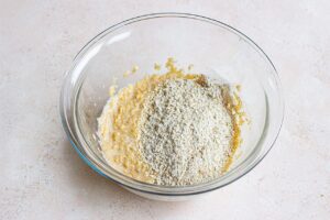 Ground oats and baking powder added to the mixing bowl.