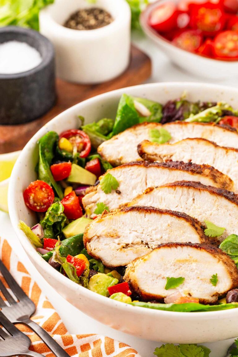 A side view of a white bowl filled with Southwest Salad.