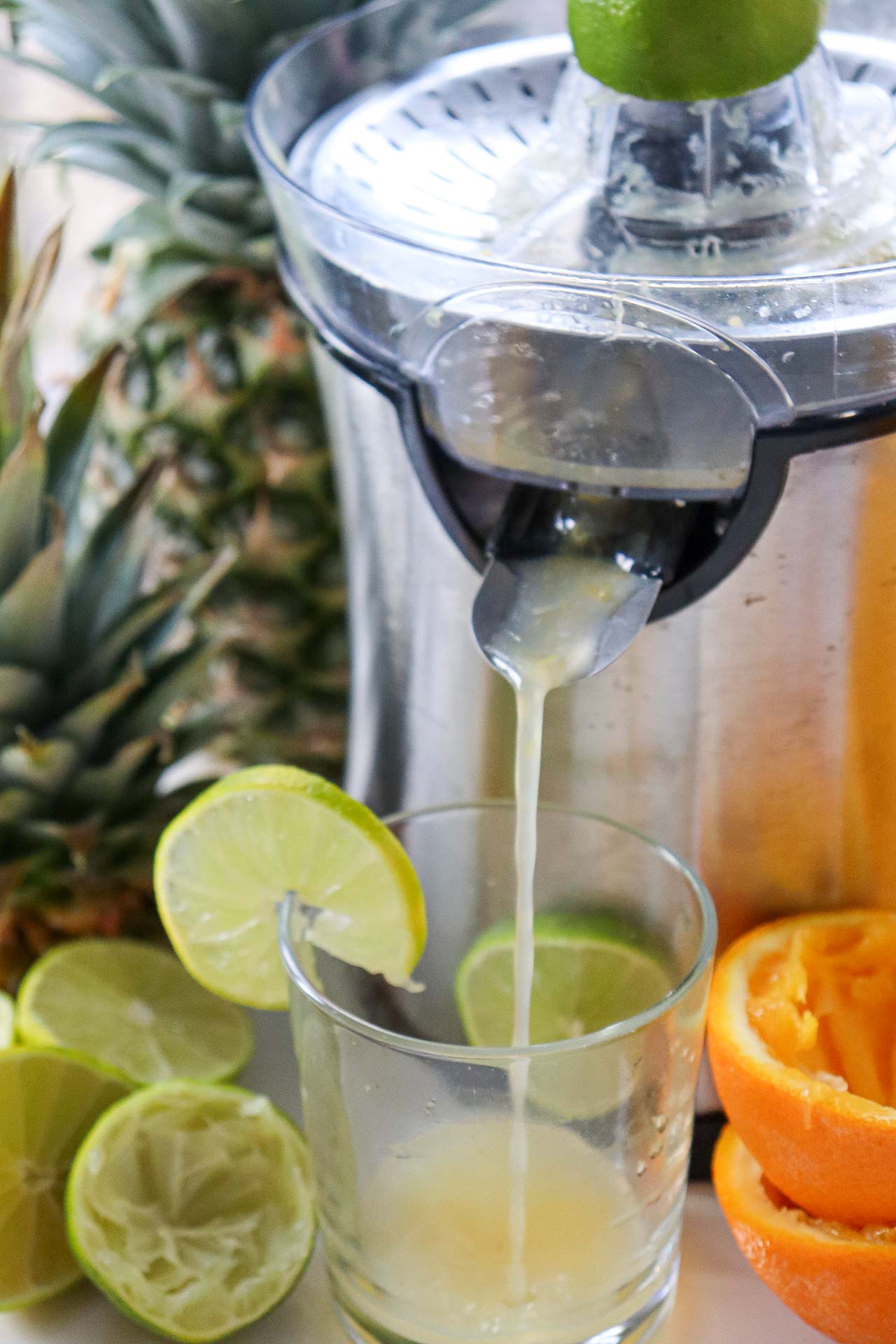 Juicing fruit in a juicer.